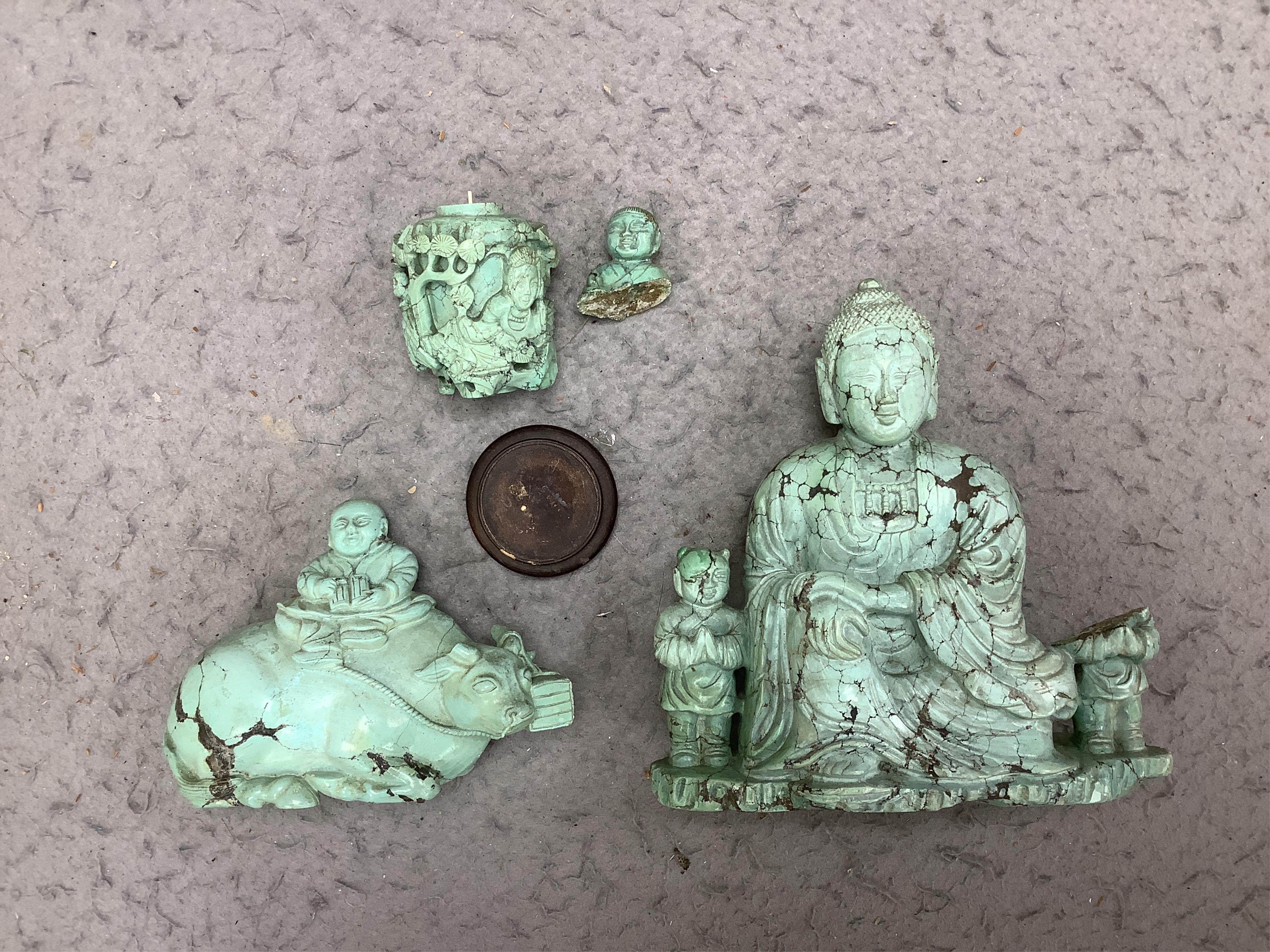 A group of Chinese turquoise matrix carvings, comprising a boy on a buffalo, 5.5in. a brushwasher, 7in. a vase and cover, 6.5in. a snuff bottle and a figure of a woman, 4.5in. (all a.f.)